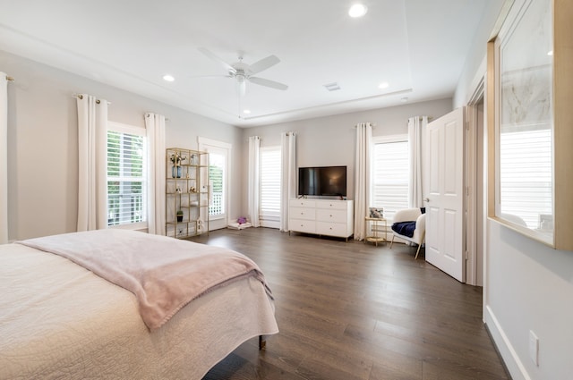 bedroom featuring ceiling fan and dark hardwood / wood-style floors