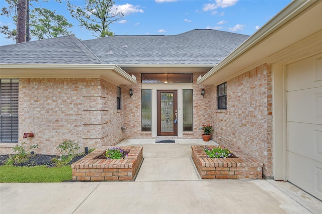 entrance to property featuring french doors and a patio