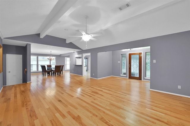 unfurnished living room with lofted ceiling with beams, light hardwood / wood-style floors, and ceiling fan with notable chandelier