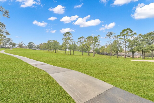 view of home's community featuring a lawn