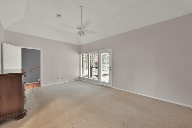 carpeted spare room with ceiling fan