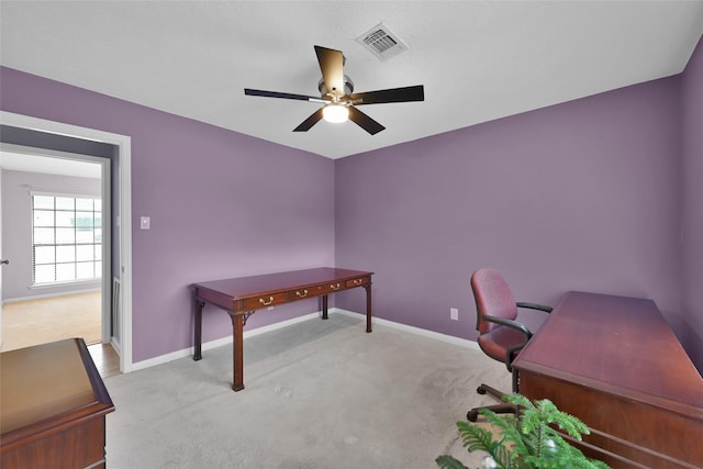 carpeted office with ceiling fan