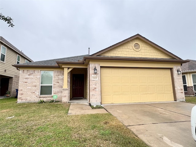 view of front of property with a garage and a front lawn