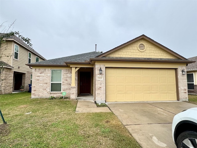 view of front of property featuring a garage and a front yard