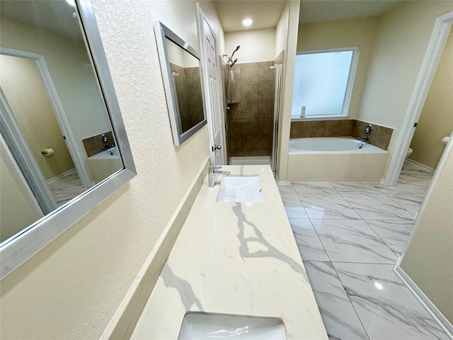 full bathroom with shower with separate bathtub, vanity, and toilet