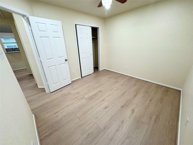 unfurnished bedroom with light hardwood / wood-style flooring and ceiling fan