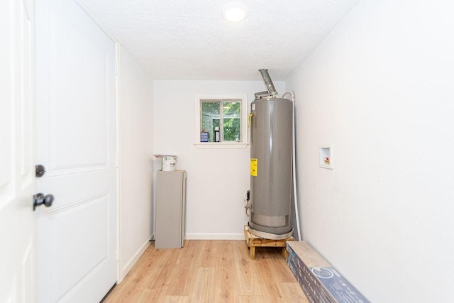 utility room with water heater