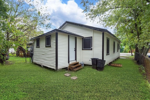 back of house featuring a yard