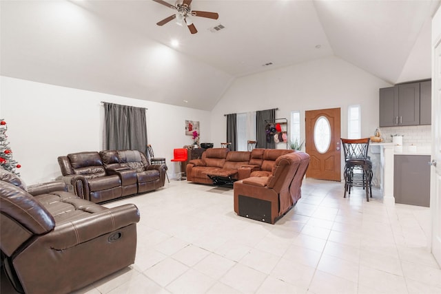 living room featuring ceiling fan, high vaulted ceiling, and light tile patterned floors