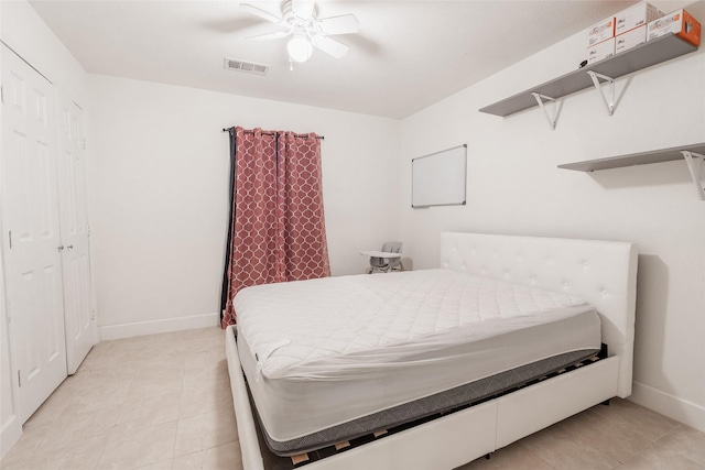 bedroom featuring light tile patterned floors and ceiling fan