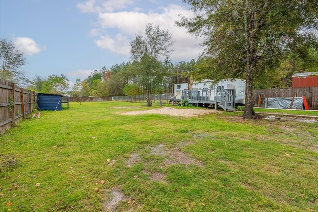 view of yard with a deck