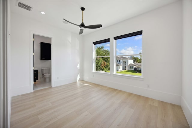 unfurnished room with ceiling fan and light hardwood / wood-style floors