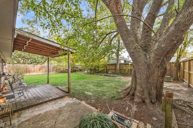 view of yard with a wooden deck