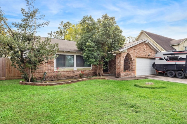 ranch-style home with a garage and a front lawn