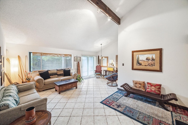 living room featuring plenty of natural light, light tile patterned floors, and a textured ceiling