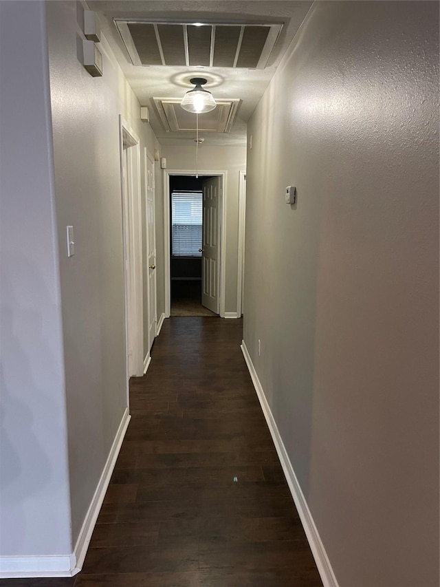 corridor featuring dark wood-type flooring