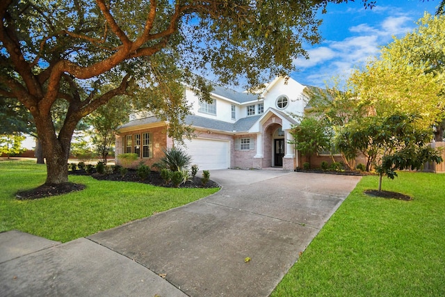 view of front of house featuring a front yard and a garage