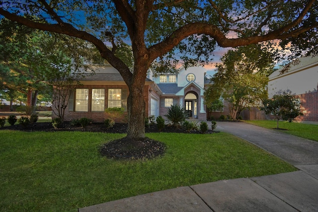 view of front of property with a lawn