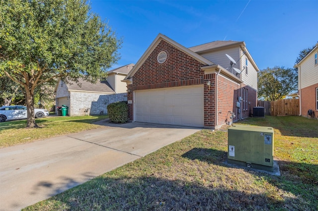 front of property featuring a garage and a front lawn