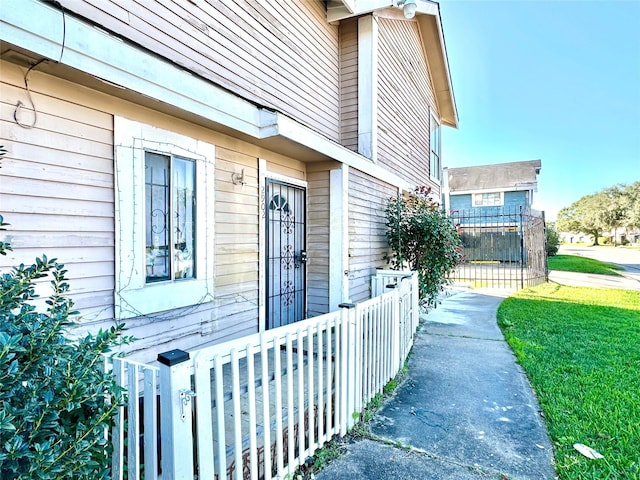 entrance to property featuring fence