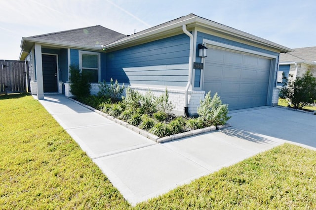 single story home featuring a garage and a front yard