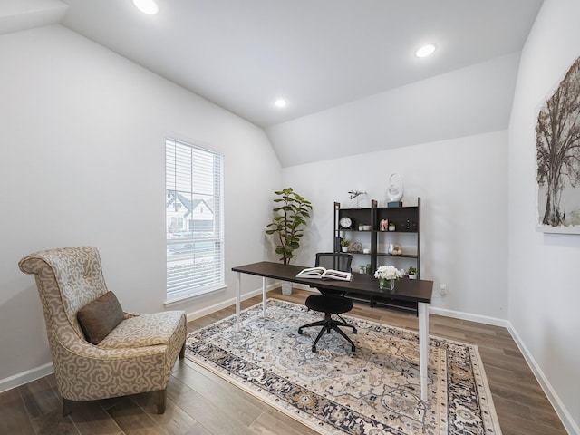 home office featuring hardwood / wood-style floors and vaulted ceiling