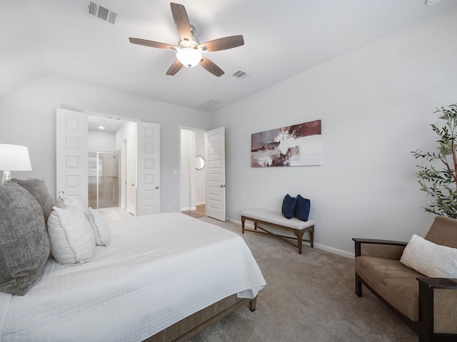 carpeted bedroom featuring ceiling fan, connected bathroom, and vaulted ceiling