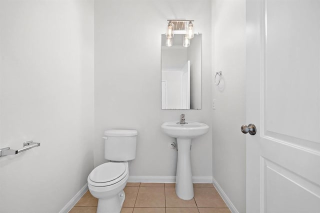 bathroom featuring tile patterned floors and toilet