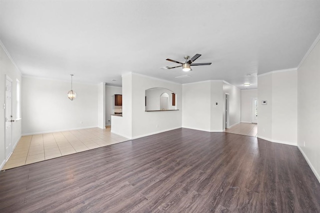 unfurnished living room featuring ceiling fan, ornamental molding, and light hardwood / wood-style flooring