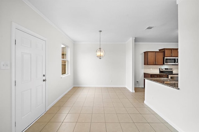 kitchen featuring tasteful backsplash, appliances with stainless steel finishes, pendant lighting, light tile patterned floors, and ornamental molding