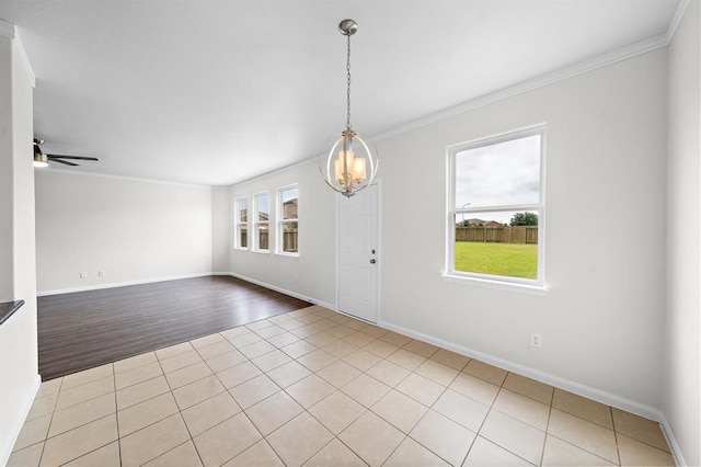 entrance foyer with ornamental molding, ceiling fan with notable chandelier, and light wood-type flooring