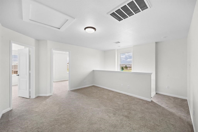 empty room featuring light colored carpet