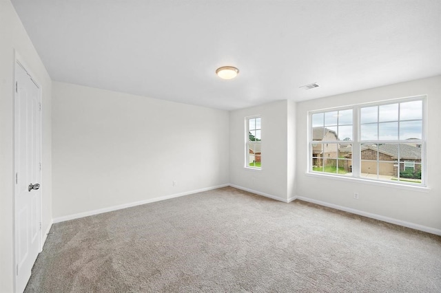 unfurnished room featuring carpet flooring