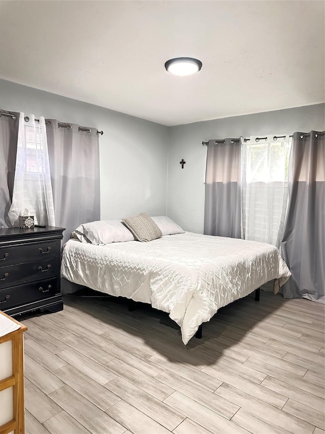 bedroom with light hardwood / wood-style floors