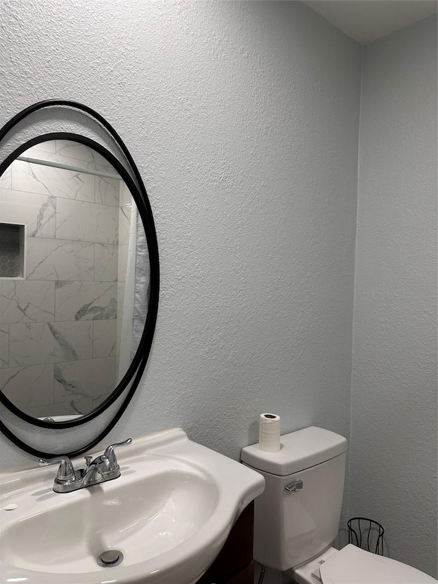 bathroom with sink and toilet