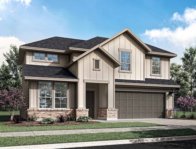 view of front of house with a garage and a front yard