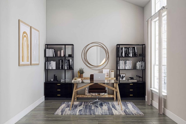 office with dark hardwood / wood-style flooring and a wealth of natural light