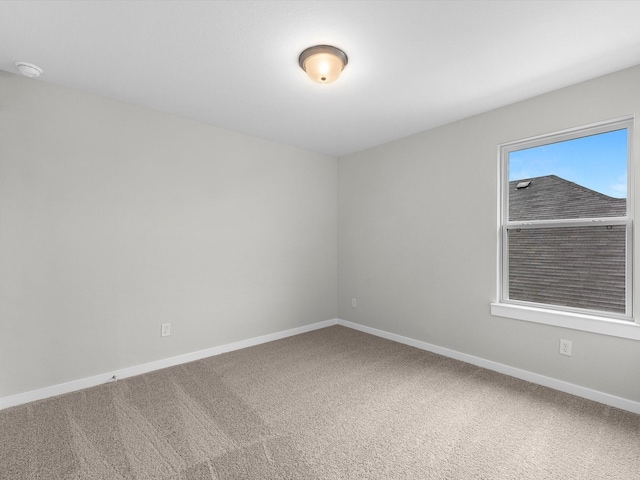 empty room with carpet flooring