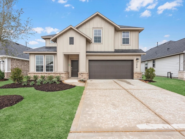 view of front of house with a front yard and a garage