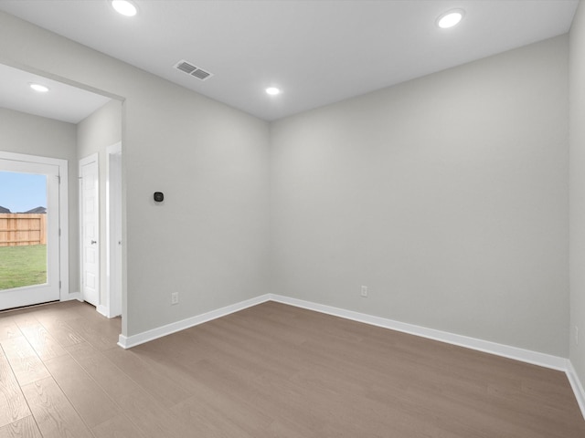 unfurnished room featuring hardwood / wood-style floors