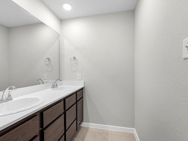 bathroom with tile patterned flooring and vanity