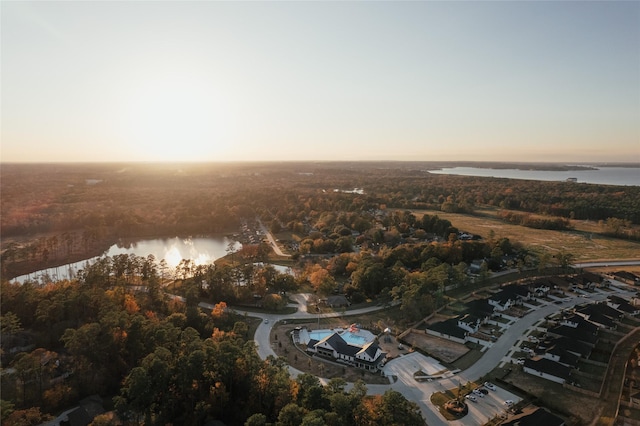 aerial view at dusk with a water view