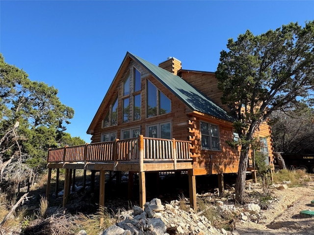 back of house with a wooden deck