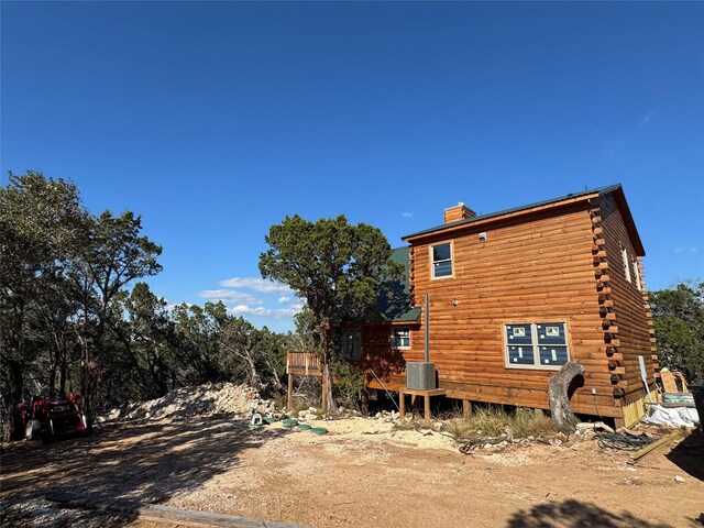 view of side of home with cooling unit