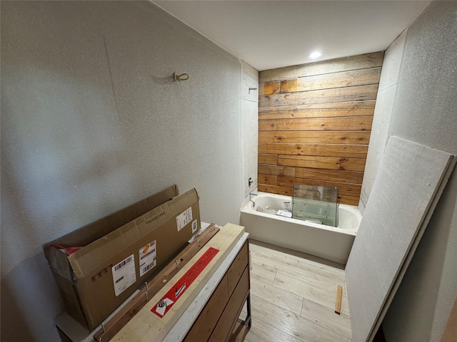 bathroom featuring a tub