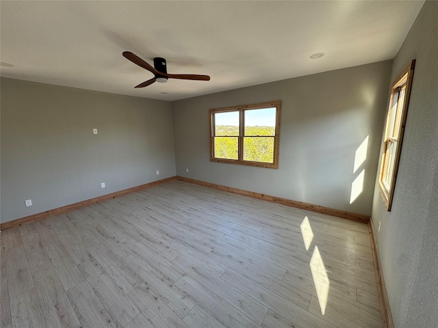 unfurnished room featuring ceiling fan and light wood-type flooring