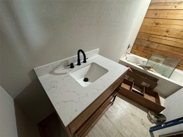 bathroom featuring vanity and a bathtub