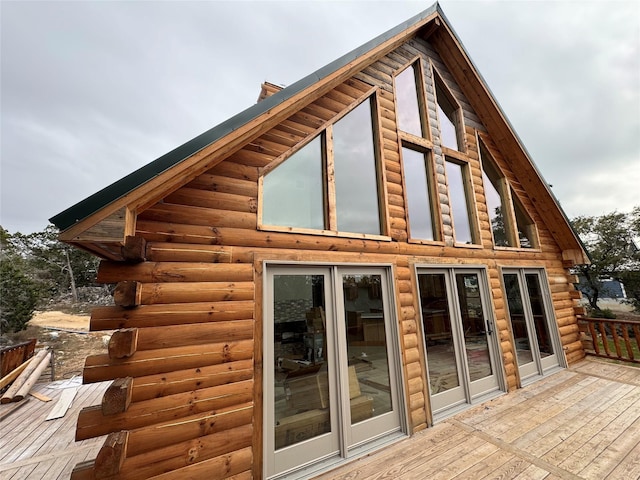 view of side of home featuring a wooden deck