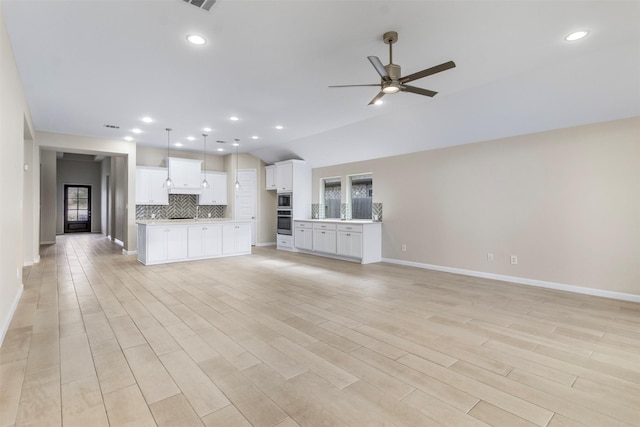 unfurnished living room with ceiling fan and light wood-type flooring