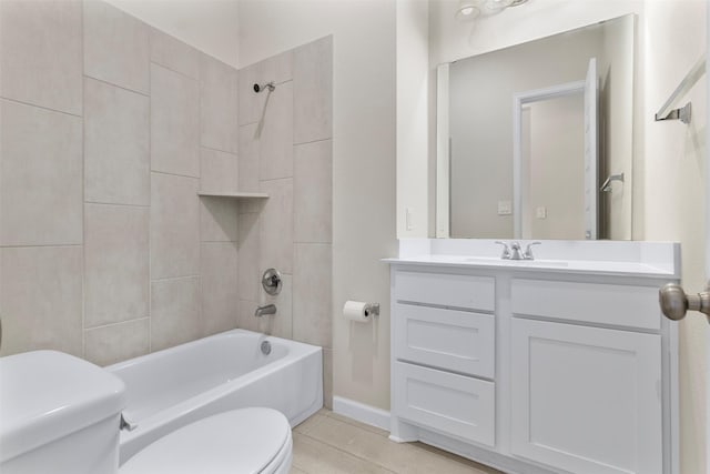 full bathroom with tile patterned flooring, toilet, vanity, and tiled shower / bath